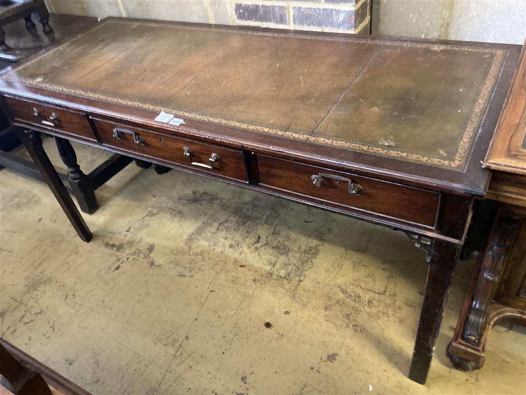 A George III style mahogany three drawer writing table, width 150cm, depth 61cm, height 77cm